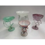 Four art glass dishes, smallest 14.5cm, largest 22cm tall