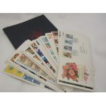 A Penny Black anniversary book and a quantity of first day covers