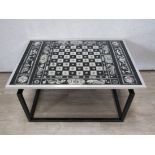 An Italian style Mid Century chess coffee table, glass top with aluminium rim, steel base. 89cm x