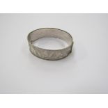 A Modernist hallmarked silver bracelet with bright diamond cut engraved Dove and Olive branch design