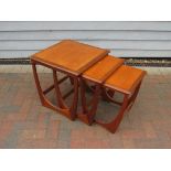 A G-Plan Fresco nest of teak coffee tables, largest table 50cm x 50cm x 51cm