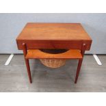 A Danish teak sewing table with slide out basket underneath. 60cm x 46cm x 52cm high