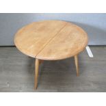 An Ercol light elm finish drop leaf occasional table. 41cm high x 61cm extended