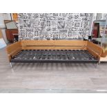 After Robin Day - a chrome and pine wood sofa frame, no cushions. 205cm long