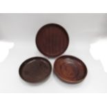 Three turned wooden serving bowls in Cocobolo and teak. Largest 30cm diameter