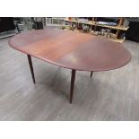 A 1960's Danish teak dining table by Mogens Kold, marked MK Craftsmandship, Made in Denamrk.