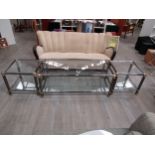 A set of three Italian two tiered sofa/coffee tables in polished dark chromed and brass metal with