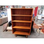 A Danish teak open bookcase raised on tapering legs. 87.5cm x 27cm x 140cm high