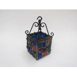 A 1960's jewelled glass and wrought iron porch lantern light fitting, 27cm high