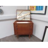 A Mid 20th Century teak dressing chest with mirror above. Chest 76cm x 43cm x 73cm high, total