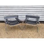 Two Marcel Breuer Wassily chairs in chrome and black leather (one with leather a/f)