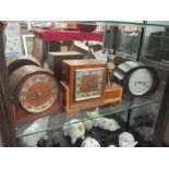 An Art Deco mantel clock with spelter figure of female, together with two others (3)