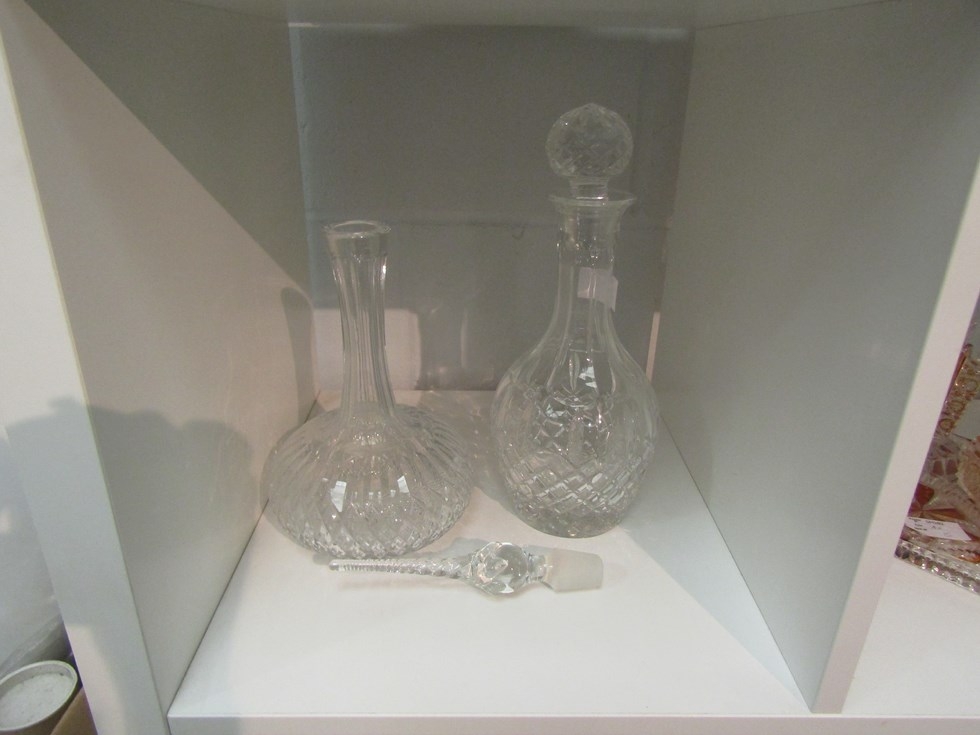 A spire finial decanter and bulbous crystal glass decanter (2)