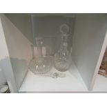 A spire finial decanter and bulbous crystal glass decanter (2)