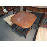 An Edwardian walnut occasional table with carved foliate top