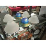An iridescent glass Art Nouveau style lampshade and two others (3)