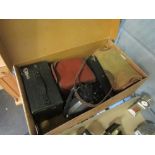 A box containing assorted vintage cameras including Kodak Brownie