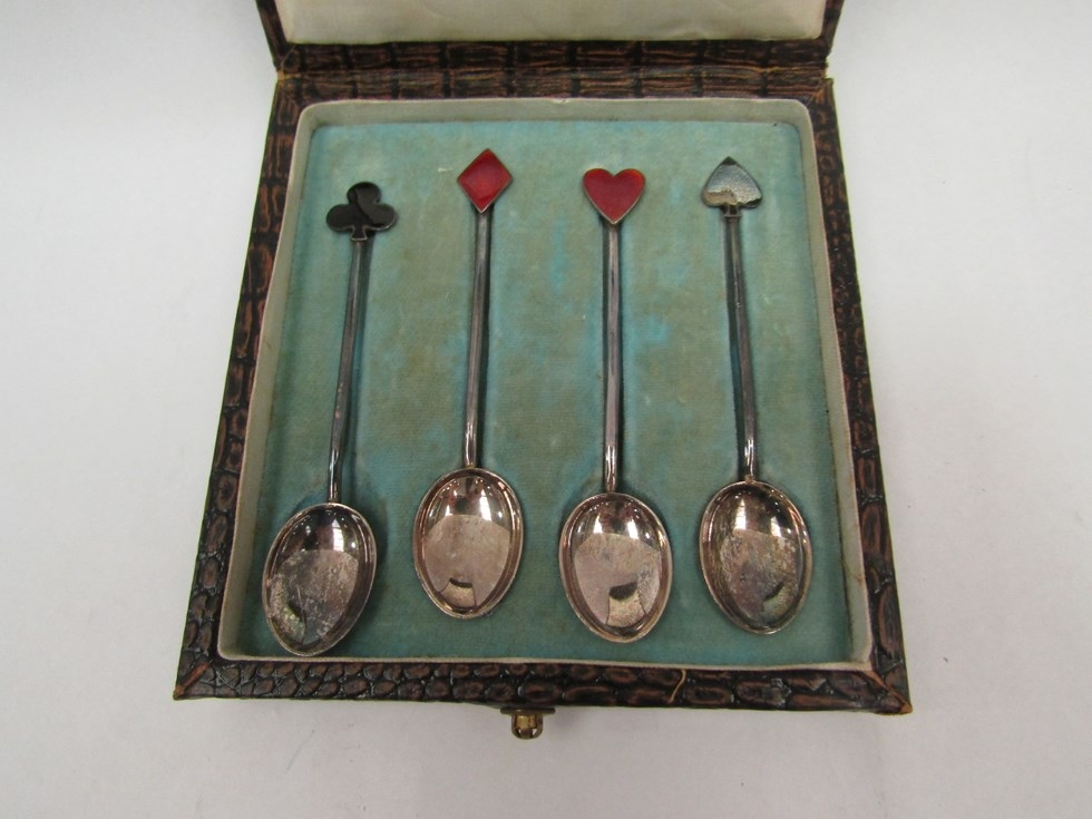 A set of four silver playing card design coffee spoons, enamelled terminals, one a/f