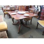 A George III mahogany round corner tilt top table, the reeded edge over a turned column and outswept