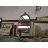 An ornate arch top mirror with floral detailing, 68cm x 35cm total