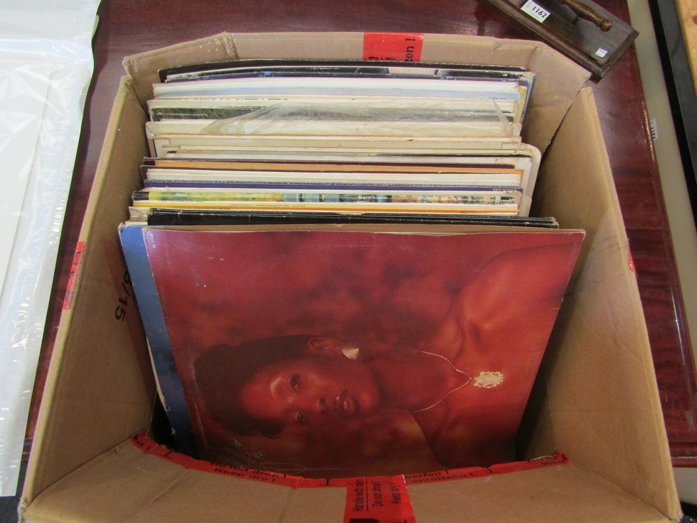 Three boxes containing albums and 45" singles