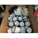 A box of enamel wares, mainly mugs