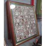 Five framed and glazed sets of cigarette cards including butterflies, boxers, military badges