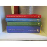 Four Harry Potter hardback deluxe edition books: Philosopher's Stone, Chamber of Secrets, Prisoner