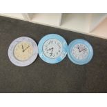 Three tin clocks with battery movement