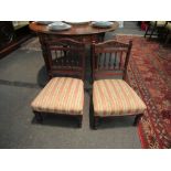 A pair of circa 1900 carved walnut bedroom chairs