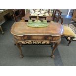 A Dutch walnut side table, the single drawer shaped frieze over ball and claw cabriole supports,