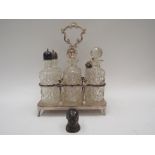A Walker & Hall silver plated condiment stand with moulded glass bottles together with a salt glazed