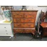 An 18th Century style walnut chest on stand, the two short and two long drawers over two further