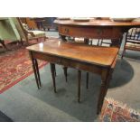 A reproduction Regency mahogany nest of tables with single drawer, fluted legs