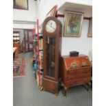 A 1920's oak cased longcase clock, silvered Arabic dial, three weights and pendulum