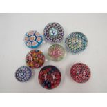 Seven millefiori glass paperweights and another (8)