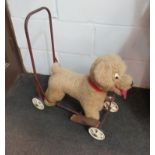 A vintage ride-on children's dog