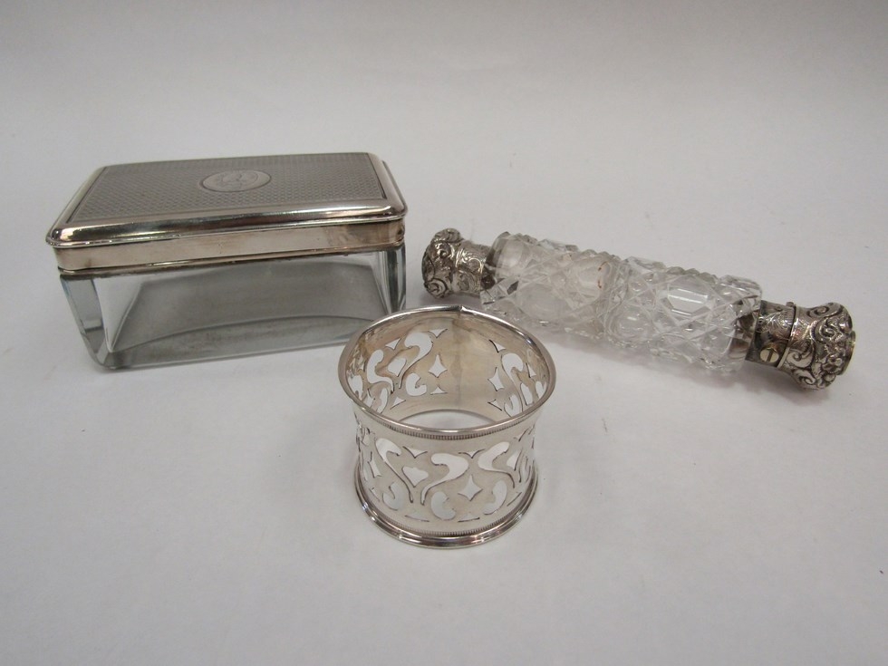 A silver topped dressing table container, a silver napkin ring and a double-ended scent bottle (3)