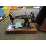 A cased Singer sewing machine