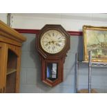 An American Ansonia Clock Co. drop dial wall clock with Roman numerated and 25 hour dial, oak