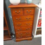 A modern slim mahogany chest of two over five drawers, 110cm x 56cm x 43cm