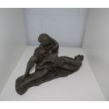 A resin bronze couple in a loving embrace, 33cm long