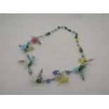 A glass bead necklace with 'bird' figural beads