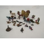 A selection of early 20th Century miniature lead and metal figures including Pekinese, Golly's etc