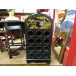 A Japanese chinoiserie style twelve bottle wine rack, enriched with gilt