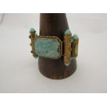 A highly ornate and costume jewellery bracelet with jade effect panel
