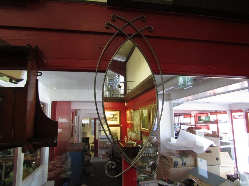 A scroll metal framed wall mirror