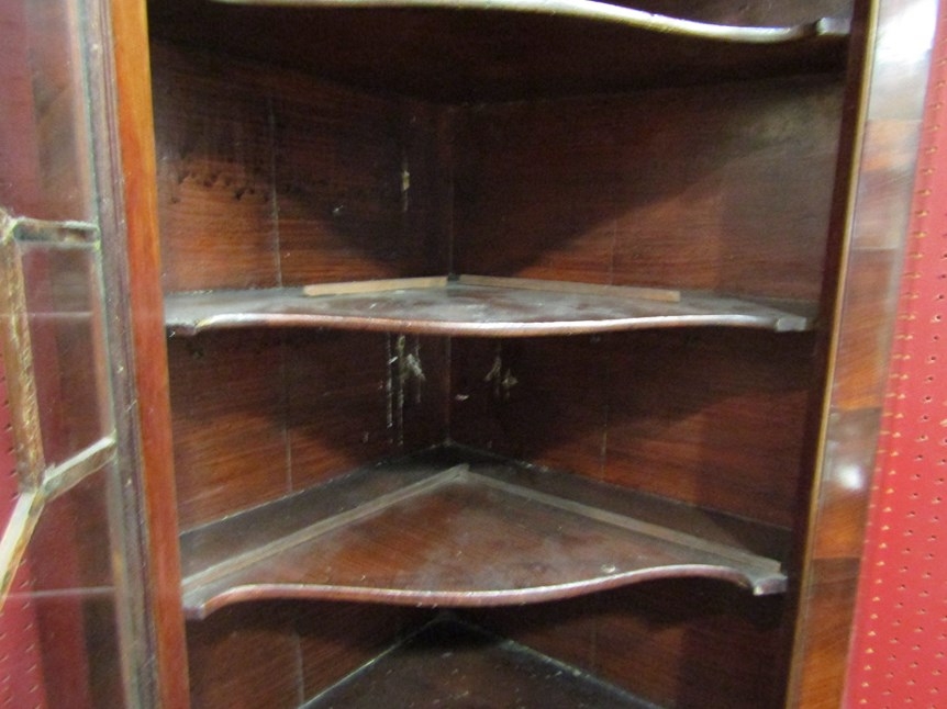 A Georgian flame mahogany corner cabinet with glazed door and shaped shelved interior with key, 86cm - Image 2 of 2