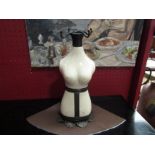 A ceramic mannequin form jewellery stand