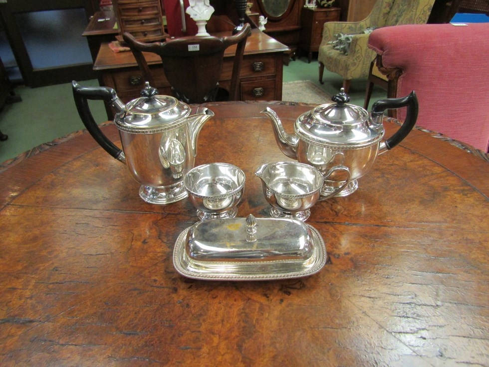 Four pieces of Viner's Sheffield plate including teapot and coffee pot with ebonised handles and